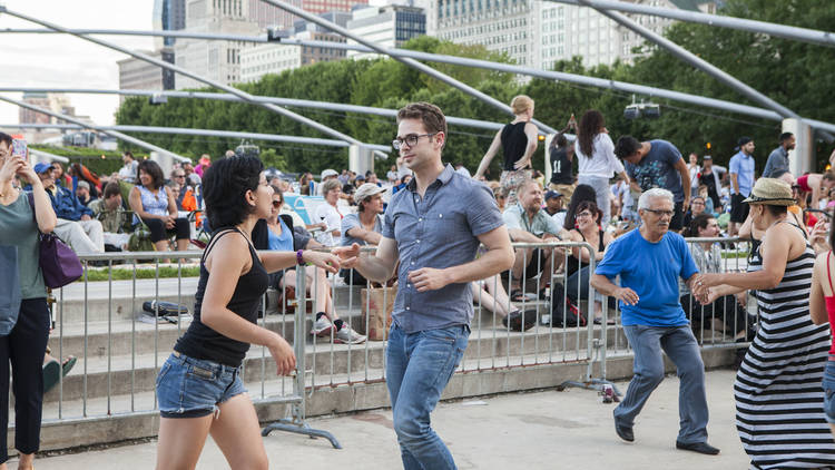 People dancing at Pritzker Pavilion