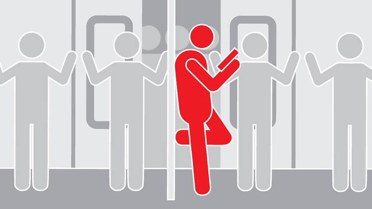 Keep your spot leaning on the pole when people are trying to exit and enter a packed train 