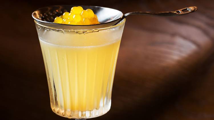 Orange cocktail with molecular caviar