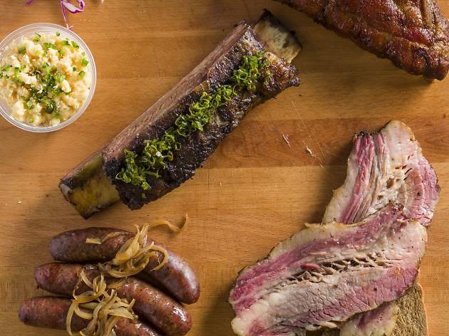 Crft Pit Rib, patrami and sausage on wooden block