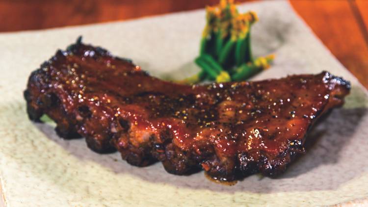 Pork ribs on white plate