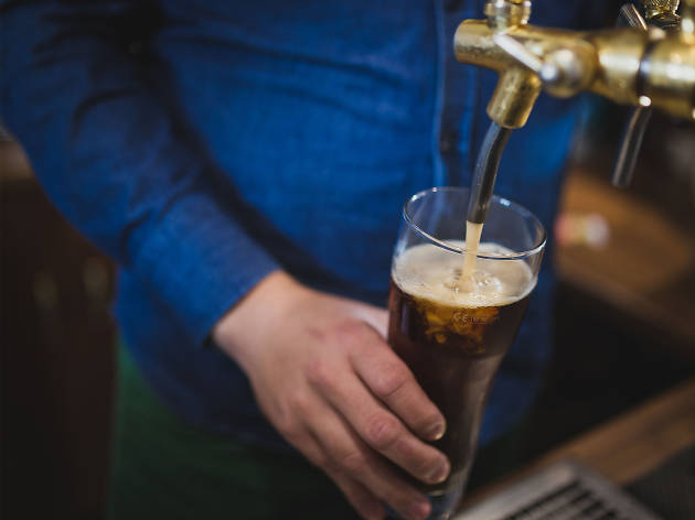 The Legacy of German Brewing Man pouring a beer
