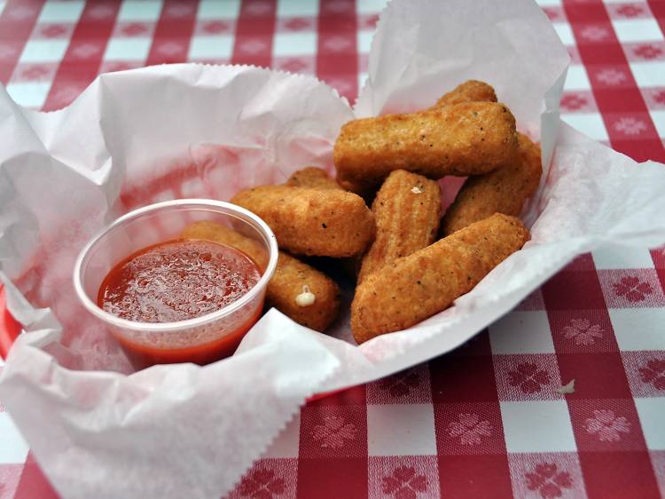 Fried cheese straws  on a red checker table cloth