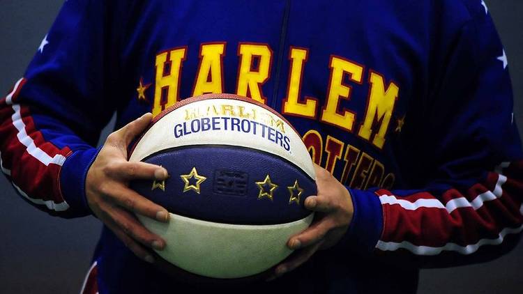 A view of a Harlem Globetrotter player, holding a ball during a special workshop with Birmingham school children at NIA Community Hall, Birmingham.