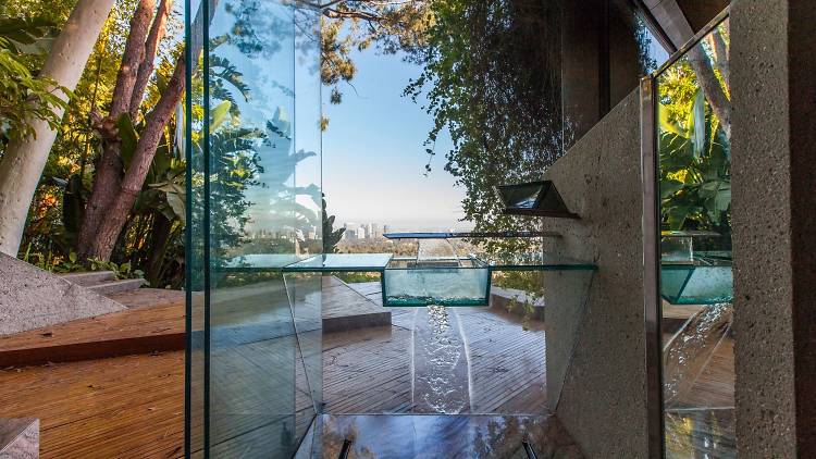 A bathroom made of mirrors, and another of glass