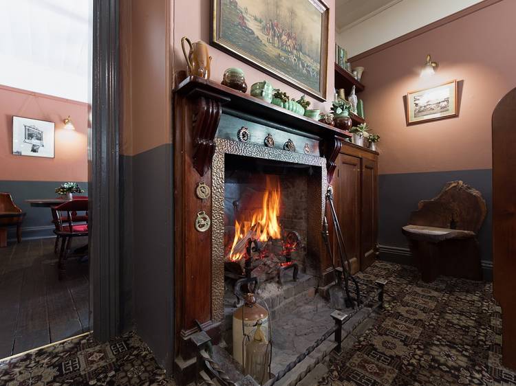 Cosy up beside a pub fireplace