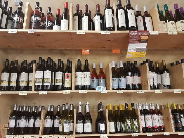 Amato's Liquor Mart A timber shelf of wine bottles