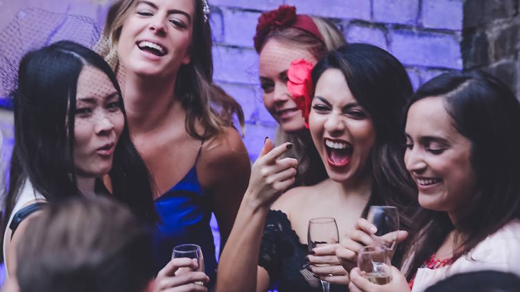 Six people celebrating the Melbourne Cup