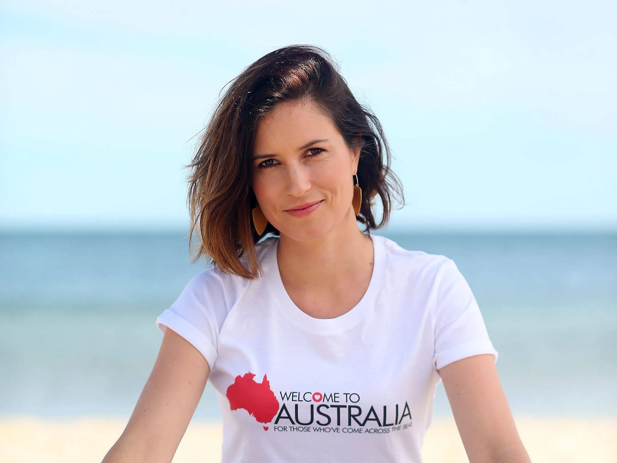Portrait of Missy Higgins sitting on a beach
