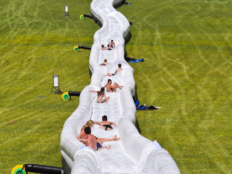 People on a giant water slide