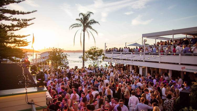 A crowd at sunset at Watsons Bay Boutique Hotel.