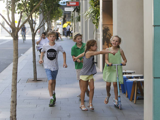 Barangaroo South kids in street Kids having fun around the cafes and restaurants of Barangaroo South
