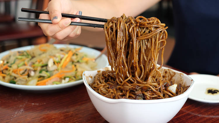 A bowl of black bean noodles