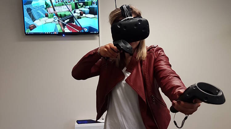 Woman at Black Site VR wearing virtual reality headset