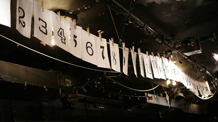 Numbers that represent which play the Neo-Futurists will perform next in “Too Much Light Makes The Baby Go Blind”