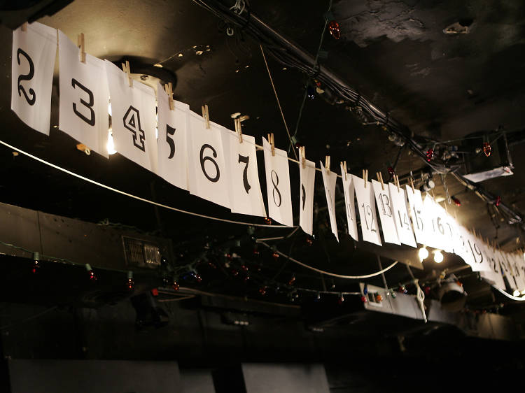 Numbers that represent which play the Neo-Futurists will perform next in “Too Much Light Makes The Baby Go Blind”