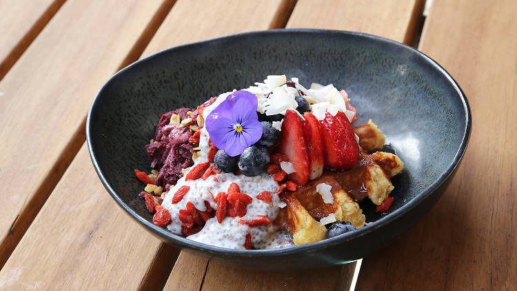 A waffle with a selection of autumn fruits