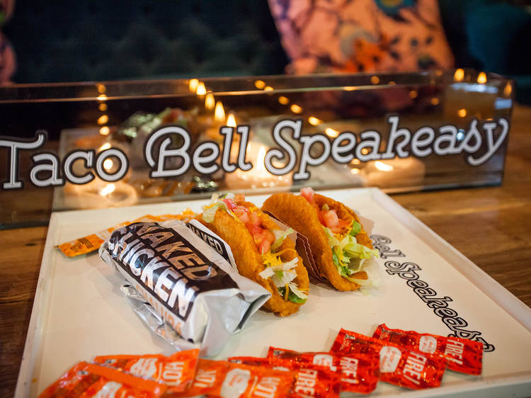 We got a sneak peek at the Taco Bell speakeasy handing out free Naked Chicken Chalupas