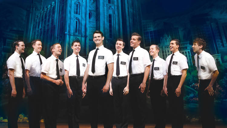 The Book of Mormon 2017 Princess Theatre Melbourne production still 02 feat Ryan Bondy CENTRE and A J Holmes FAR RIGHT and ensemble photographer credit Jeff Busby