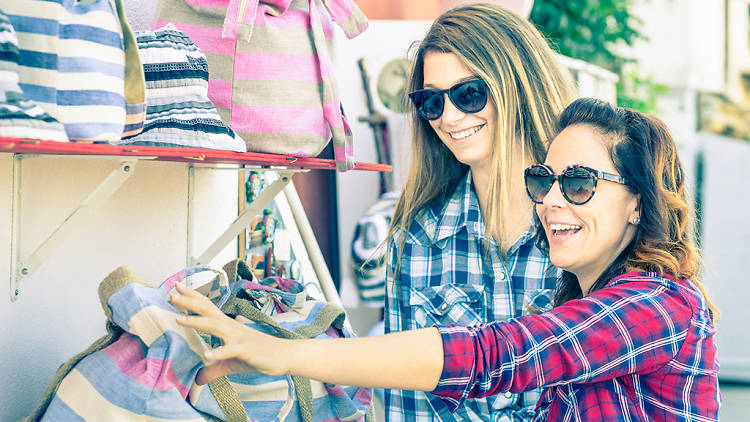 girls shopping at flea market