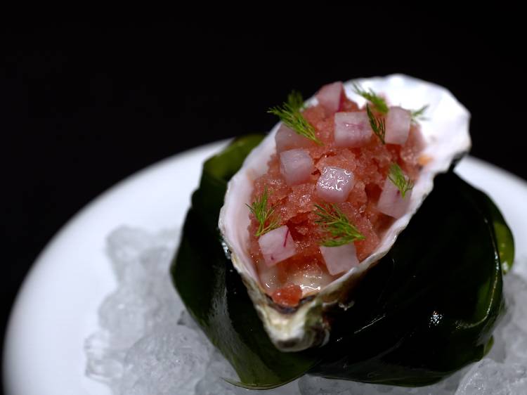 Amber: Freshly shucked Ebisu winter oyster with plum, beetroot granité and black pepper