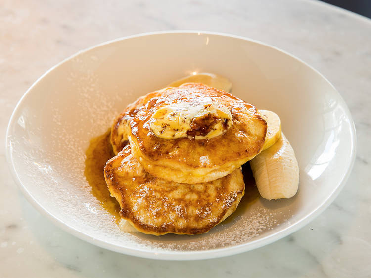 Ricotta hotcakes with banana and honeycomb butter at Bills