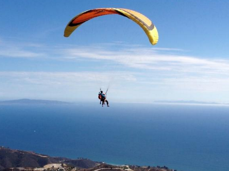 Take in the views while paragliding