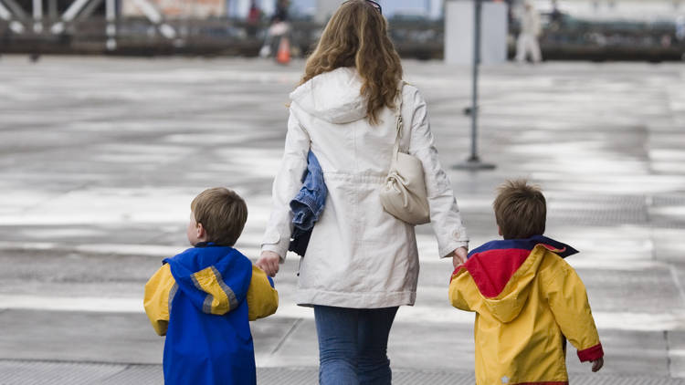 A mom walks with her two sons in San Francisco