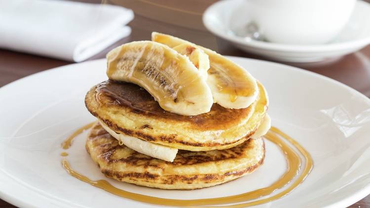 Pancakes, banana, maple syrup and honeycomb butter