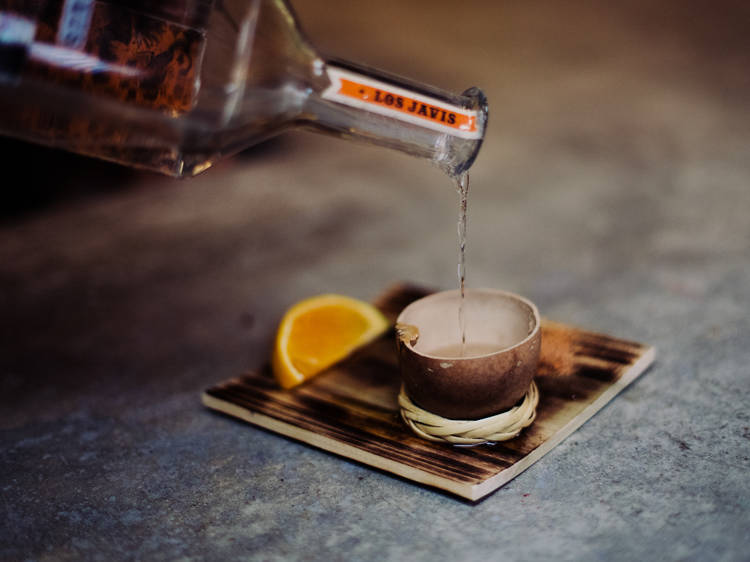 Mezcal pours at Guelaguetza