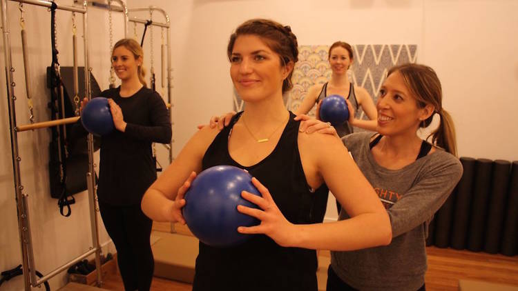 One woman holding a small ball