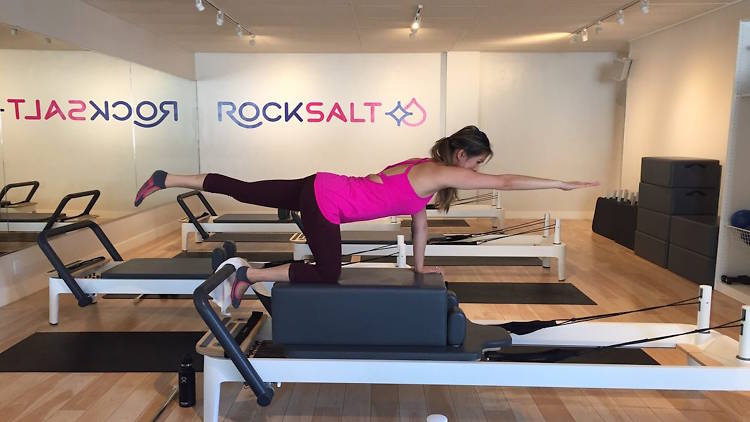 Woman on a pilates reformer