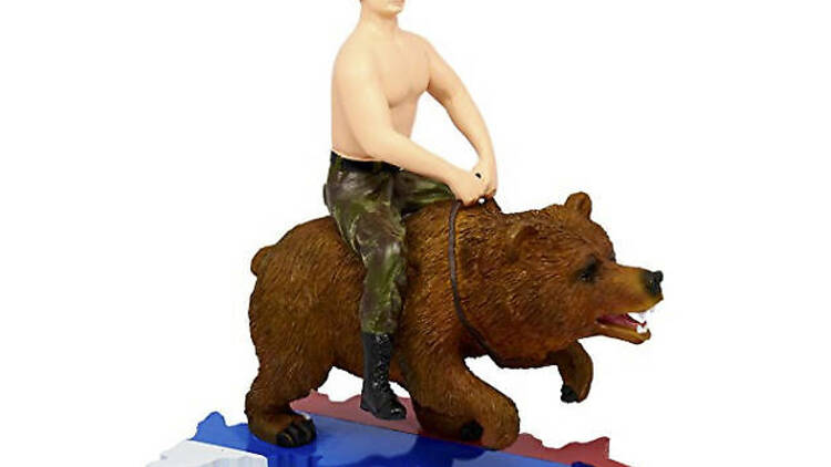 Putin. Topless. Riding a bear across Russia.