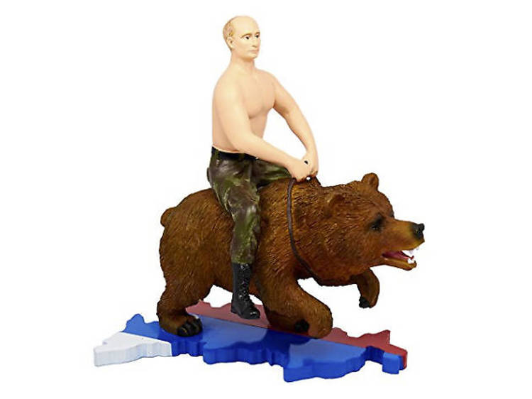 Putin. Topless. Riding a bear across Russia.