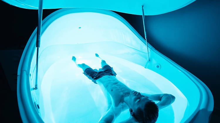 Person lying in a floatation tank