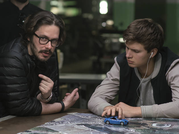 baby driver Director Edgar Wright (left) and Ansel Elgort on the set of TriStar Pictures' BABY DRIVER.