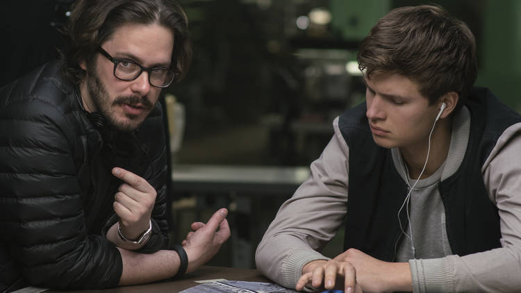 Director Edgar Wright (left) and Ansel Elgort on the set of TriStar Pictures' BABY DRIVER.
