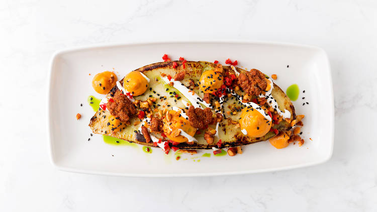 Roasted sweet potato with spiced walnuts, yogurt and pickled chilies