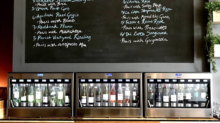 A self-serve wine machine and list