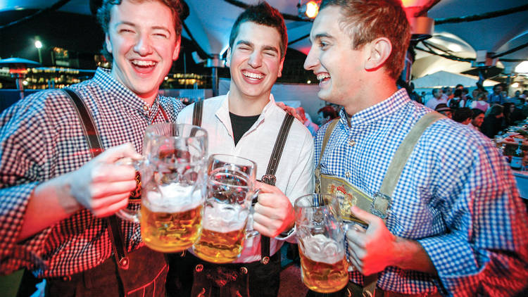 Men drinking steins of beer at Oktoberfest