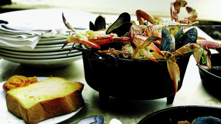 Mixxxed Seafood in a Black Cast-Iron Pot - Manta Ray