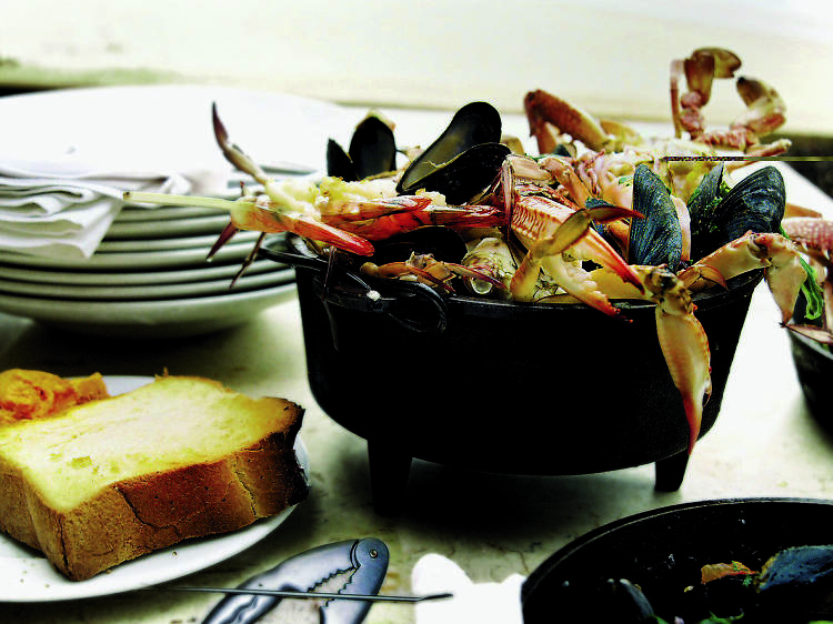 Mixxxed Seafood in a Black Cast-Iron Pot - Manta Ray