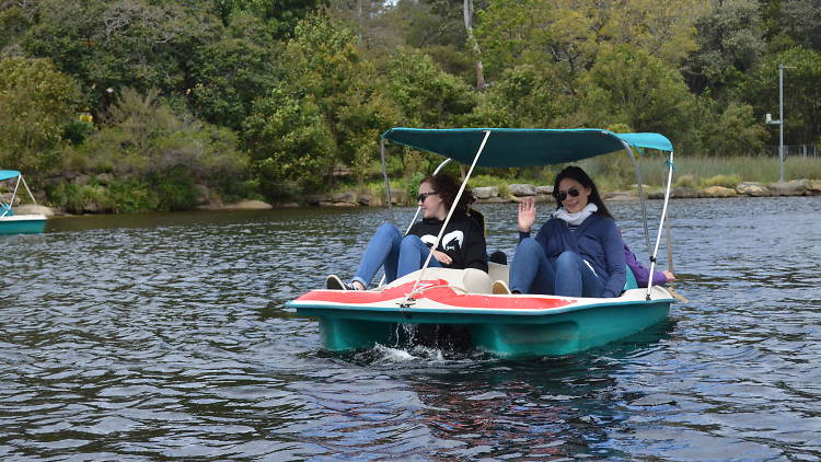 People on a rowboat at Parramatta Lakes