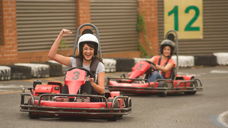 Two women in go karts