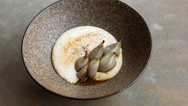 Baby Onions stuffed with morcilla, charred onion consommé, eggplant, Époisses mousse at Gerard's Bistro, $19