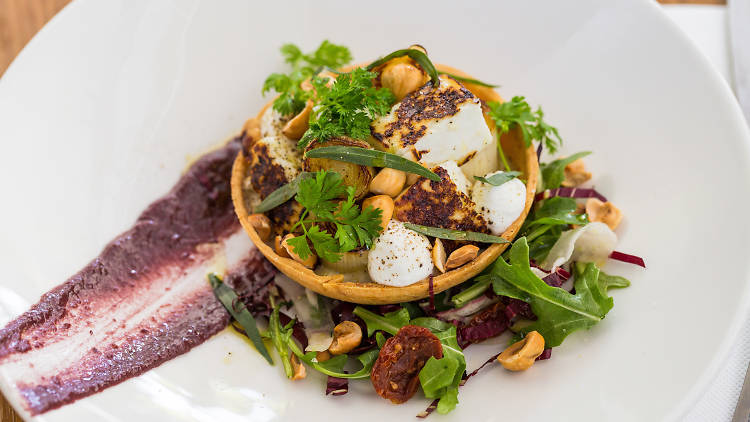 Roasted leek and fennel tart, buffalo haloumi, biter leaves, tapenade, hazelnuts and tarragon at Harvey's Bar and Bistro, $18