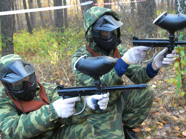 Generic paintball players prepare for fight Generic paintball players prepare for fight