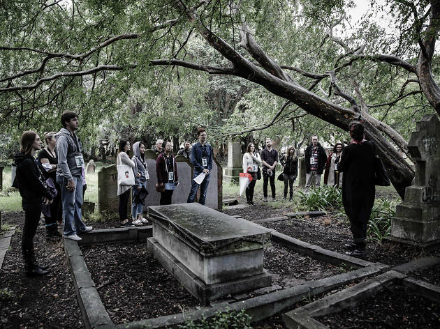 Ghostly Newtown Tour Group of people standing around a graveyard