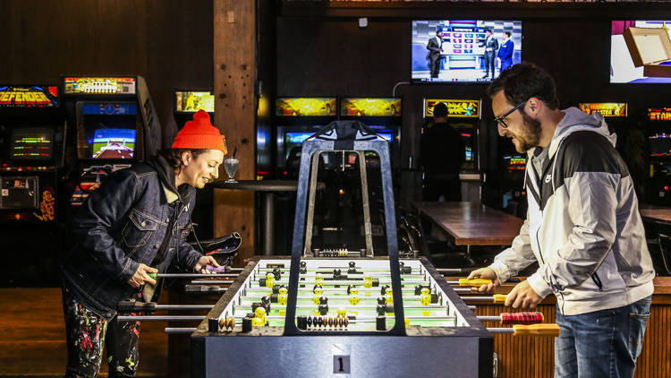 Waste quarters at an arcade bar