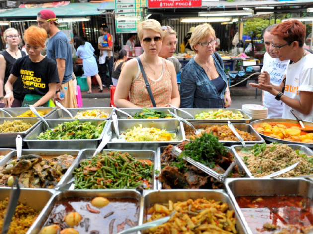 Bangkok Street Food for Thai Tourism Promo Woman looking at street food in Bangkok